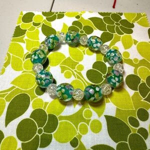 Green and white beaded bracelet